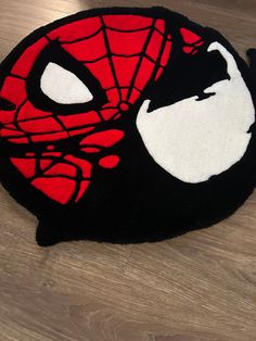 Custom Handmade Spider-Venom rug. Able to customize at different sizes or colors, please message me if you have any questions. At just a glance, this looks like just a tufted vibrant rug, but its a comic inspired art piece. This rug can brighten any room and just add a hint of fun.  This rug is versatile and can be used in any area of your home. Whether you want to place it in your living room, bedroom, or even your kitchen, it will add a cozy and inviting atmosphere to the space. The texture of this rug is soothing to the touch, providing comfort and warmth underfoot.  The rug can be placed anywhere, but I highly suggest its placed in low trafficked areas.  Placing in high trafficked areas will increase wear and tear over time.  To ensure the highest quality, we have used 100% premium acr Custom Tufted Rug, Turfing Rugs, Venom Rug, Spiderman Room Ideas, Halloween Rugs, Vibrant Rug, Tufting Rug, Tufting Ideas, Mens Room Decor