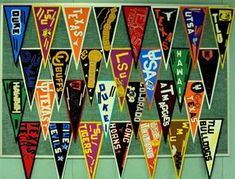 there are many pennants hanging on the wall