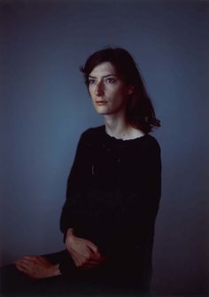 a woman in black shirt posing for a photo