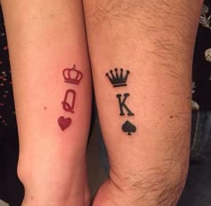 two people with matching tattoos on their arms, one has a crown and the other has a heart