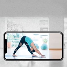 an image of a woman doing yoga on her phone