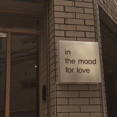 a sign on the side of a building that says, in the mood for love