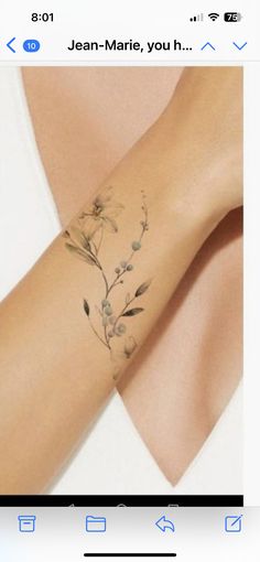 a woman's arm with flowers on it and the words jean - marie youh