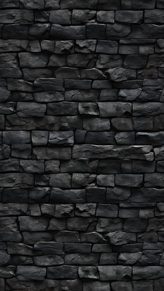 a black stone wall is shown as if it were made out of rocks or stones