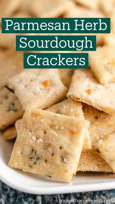 homemade parmesan herb sourdough crackers in a white bowl with text overlay