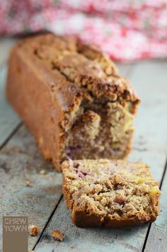 a loaf of banana bread sitting on top of a wooden table