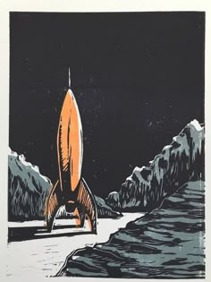 an orange and black rocket sitting on top of a snow covered ground next to mountains