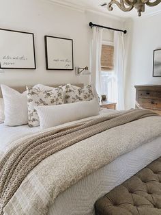 a large bed sitting under a window in a bedroom