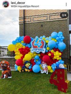 the balloon arch is decorated with balloons and paw patrol characters