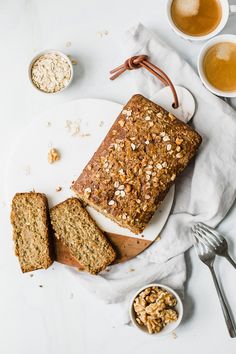 two slices of banana bread on a plate next to bowls of oatmeal