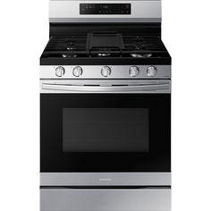 an oven with the door open and its light on, in front of a white background