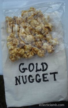 a bag filled with gold nuggets sitting on top of a table