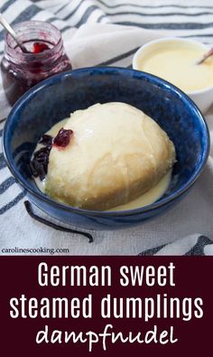 german sweet steamed dumplings with cranberry sauce in a blue bowl on a white and black striped tablecloth