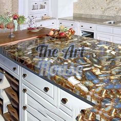 an image of a kitchen counter top that is made out of marble and has fruit on it