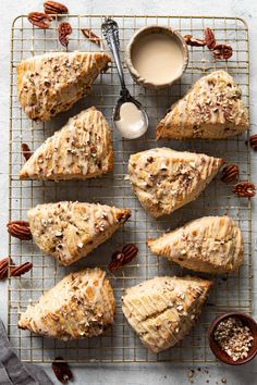 several slices of pecan bread on a cooling rack with butter and nuts next to it