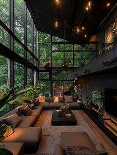 a living room filled with furniture and lots of windows