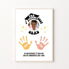 a white poster with an image of a child's handprint