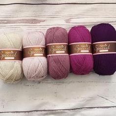 six skeins of yarn in various colors