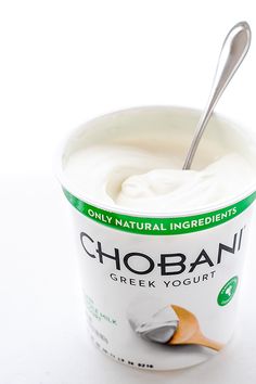 yogurt in a bowl with spoon on the side and only natural ingredients added to it