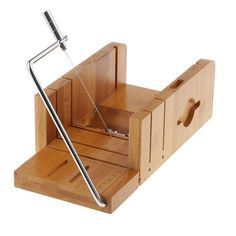 a wooden mouse trap with a metal handle