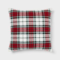 a red and white plaid pillow