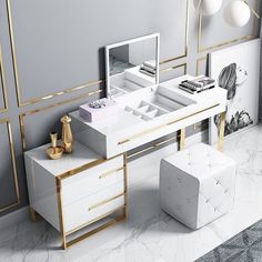 a white desk with gold trim around it and a mirror on the wall next to it