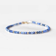 "This hand made bracelet showcases a stunning selection of genuine Sapphire rondelles. This makes a wonderful gift for someone with a September birthday, or any Sapphire lover in your family or friend circle. All jewelry will arrive in an elegant, ready-to-gift drawstring pouch within a gift box. Bracelet Size Guide: The last length option measures 6.5\" with a 1.5\" extender chain, for a total wearable length of 8\". This bracelet fits 99% of recipients. If for any reason you need an adjustment Friend Circle, Star Sapphire Gemstone, September Birthstone Jewelry, September Birthday, Birthstone Bracelets, September Birthstone, Drawstring Pouch, Sapphire Gemstone, Wedding Bracelet