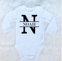 Our personalized bodysuits can be customized with any name. They are available in sizes newborn and 0-3 months. Our newborn bodysuits come with mitten cuffs. Boy Namea, Onesie Cricut, Newborn Onsies, Mini Boo, Baby Hunter, Baby Gifts To Make, Random Products, Fav Products