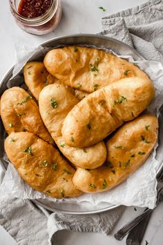 a bowl filled with bread on top of a table