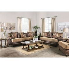 a living room filled with lots of furniture and decor on top of a hard wood floor