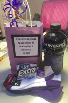 a bottle of water and some other items on a table