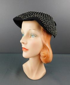 Vintage Black 1950s Hat with Black & White Netting ERA: True vintage hat from the 1950s MEASUREMENTS: The hat will fit a 21 to 22 inch head, will need a pin to secure MATERIAL: straw, netting LABEL: none Black creped straw hat with black netting over the top that has white specks on it. Black velvet under the front of the hat and a black velvet bow on the back.  CONDITION: Excellent condition. Vintage Black Cap, Black Retro Party Hat, Retro Black Party Hat, Retro Cloche Hat With Curved Brim For Evening, Vintage Cloche Hat With Short Brim For Evening, Retro Curved Brim Cloche Hat For Evening, Vintage Black Costume Hat With Curved Brim, Vintage Flat Cap For Formal Occasions, Vintage Brimmed Cloche Hat For Evening