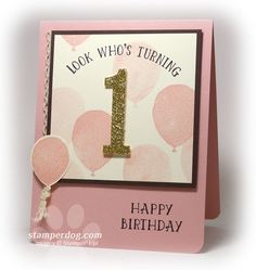 a pink birthday card with the number one on it and balloons in the background that says, look who's turning 1