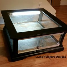 a glass display case sitting on top of a hard wood floor