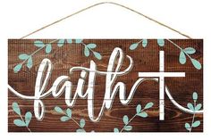 a wooden sign with the word faith painted on it