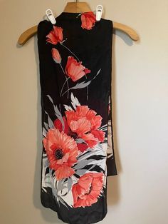 Vintage black scarf with reddish orange flowers. Measures 51.5 x 10.5.  Not sure of material. Black Floral Print Scarf, Reddish Orange, Black Scarf, Floral Scarf, Orange Flowers, Vintage Floral, Vintage Black, Orange, Floral