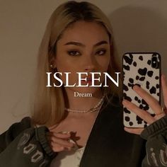 a woman holding up a cell phone in front of her face with the text, isleen