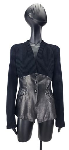 Stunning vintage Thierry Mugler Couture blazer is a true statement piece. It features Mugler's signature wasp-waist design, made from soft lambskin leather.  The sleek, structured fit is enhanced by contrasting ribbed knit sleeves and upper bodice. The leather body defines the waist, creating the dramatic silhouette characteristic of Mugler's iconic style. Details: Designer: Thierry Mugler Couture Size: French 38 (fits like Small/Small Medium) Material: Tissu 1 (main fabric): 100% Lambskin leather Doublure (lining): 100% Viscose Garniture (knit): 76% Wool, 20% Polyamide, 4% Lycra Made in: Italy Condition: Good used vintage condition with minimal signs of wear Color: Black Features: Button-front, fitted waist, ribbed knit sleeves, and lambskin leather body Mugler Blazer, Thierry Mugler Couture, Mugler Couture, Vintage Thierry Mugler, Couture Blazer, Wasp Waist, Blazer Details, Dramatic Silhouette, Thierry Mugler