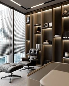 a chair and ottoman in front of a book shelf with shelves on the wall next to it