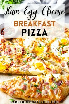 ham egg cheese breakfast pizza on a cutting board with text overlay that reads ham egg cheese breakfast pizza