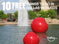 two red balls sitting on top of a lake next to a fountain with the words 10 free things to do in dallas with kids