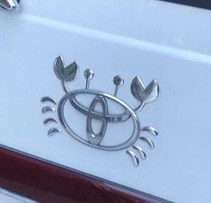 an emblem on the side of a white car