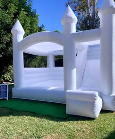 an inflatable castle is set up on the lawn