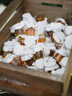 a wooden box filled with lots of white and brown gummy bears