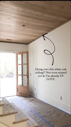 an empty room with some stairs and a wall decal that says, deliver this while it's not ceiling