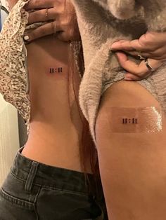 two women with small tattoos on their butts