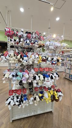 the stuffed animals are on display in the store