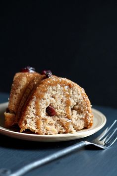 two pieces of cake sitting on top of a white plate