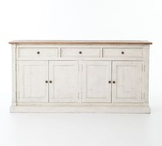 an old white wooden sideboard with four doors and two drawers on the bottom shelf