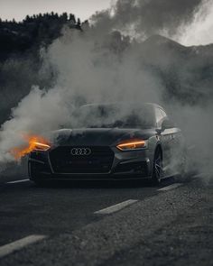 a car with flames coming out of it's hood